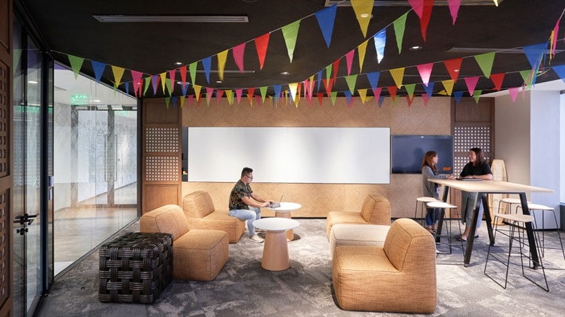Manila office space with BHP employees working and collaborating 