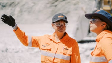 people chatting on a mine site