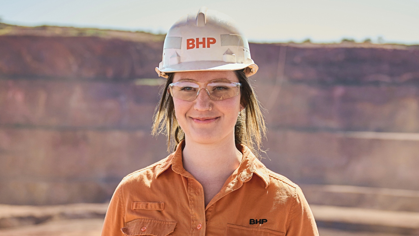 Rachel shown smiling with landscape in background